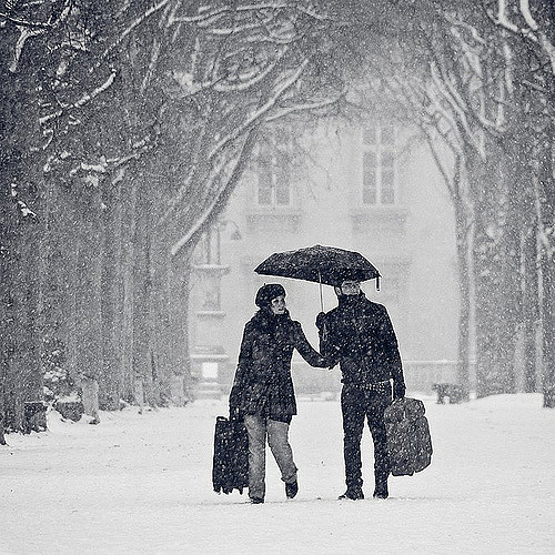 Couple under rain via flickr by Gregory Bastien